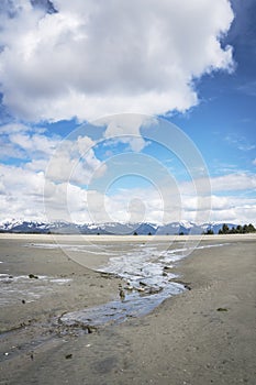 Gustavus beach at low tide with clouds