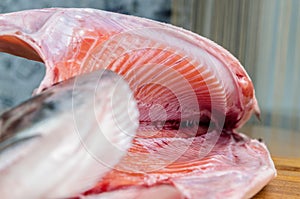 Gutted raw salmon on a cutting Board