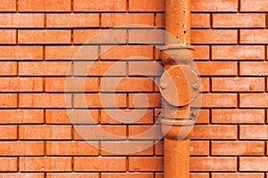 Gutter downpipe and brick wall