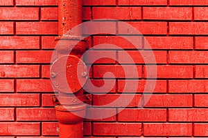 Gutter downpipe and brick wall