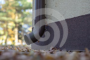 Gutter draining rainwater. The building is equipped with drainage of rainwater from the roof.