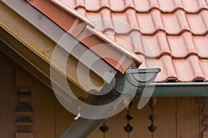 Gutter made of copper sheet. Gutter construction with downpipe