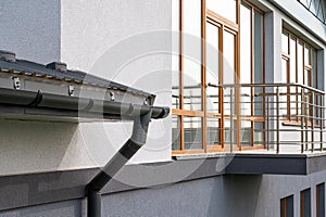 . Gutter system for a metal roof. Holder gutter drainage system on the roof