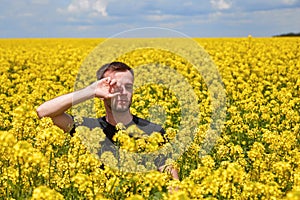 a guy with an allergy to pollen tears are flowing