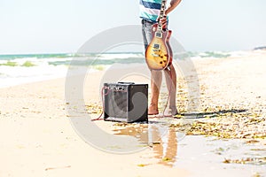 The guy on the beach with musical instruments