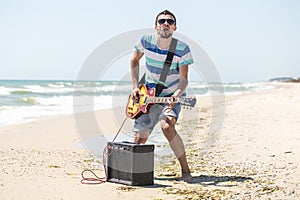 The guy on the beach with musical instruments