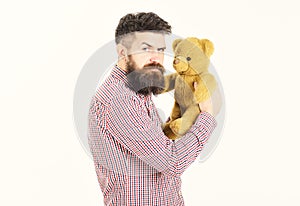 Guy with beard does not like to share soft toy.