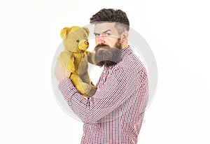 Guy with beard does not like to share soft toy.