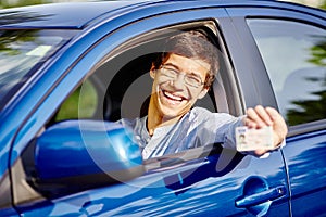 Guy in car with driving license