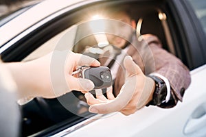 Guy in car with laptop and phone