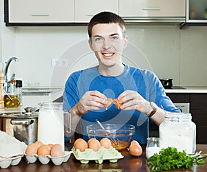 Guy cooking scrambled eggs