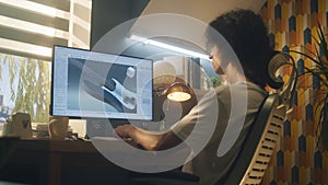 Guy creating 3D prototype of guitar