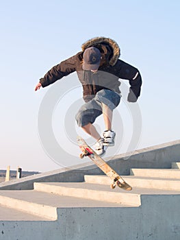 Guy doing a stunt with his skateboard