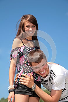 Guy embraces girl for waist