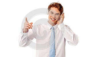 Guy enjoying music isolated over white