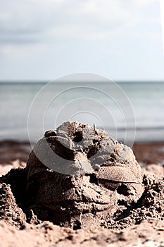 Guy Fawkes face in the sand