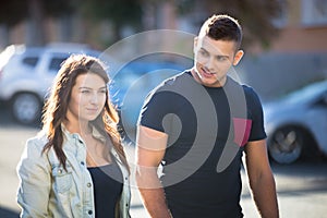 Guy flirting with young woman on the street