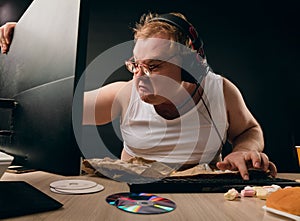 Guy gets addicted to computer. close up side view photo photo