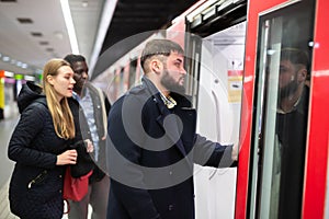 Guy getting on subway train