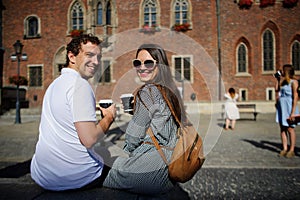 Guy and girl on the background of a beautiful old building.