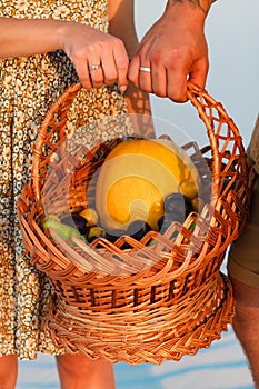 guy and a girl with a basket in their hands