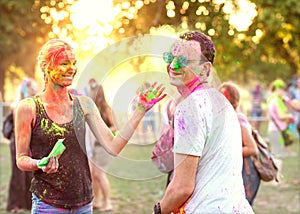 Guy with a girl celebrate holi festival