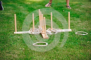 Guy and girl compete in the ring toss.