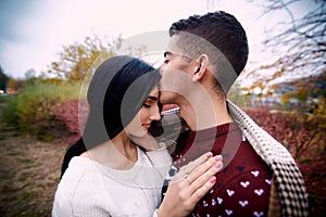 Guy with a girl covered blanket photo