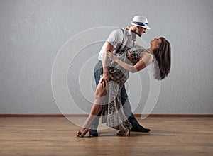 Guy and girl in dance movement .