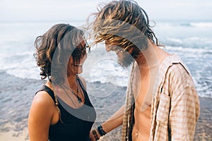 Guy and girl have fun on the beach