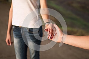 Guy with a girl holding hands