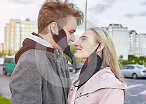 Guy and girl kissing. expressing a desire to remove the mask and be free. the concept of freedom and relationships without