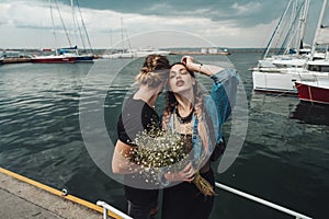 Guy and girl on pier