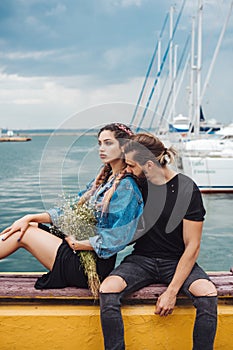 Guy and girl on pier