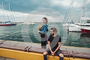 Guy and girl on pier