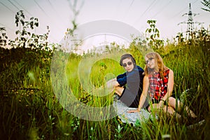 Guy and the girl sitting in the grass