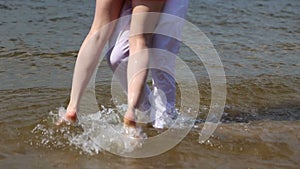 Guy and girl splashing in the water