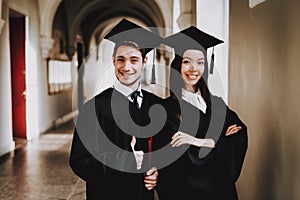 Guy. Girl. Standing. Corridor. University. Robes.