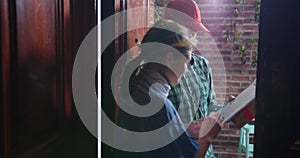 Guy and girl talking standing at the front door of the apartment