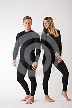 Guy and girl in thermal underwear on a white background