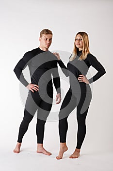 Guy and girl in thermal underwear on a white background