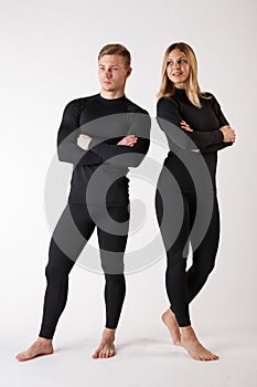 Guy and girl in thermal underwear on a white background