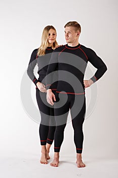 Guy and girl in thermal underwear on a white background