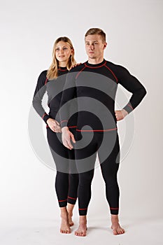 Guy and girl in thermal underwear on a white background