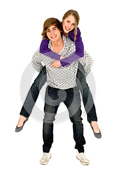 Guy giving girlfriend a piggyback ride