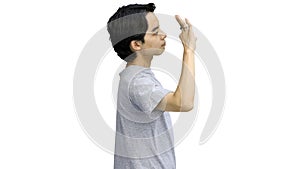 A guy in a gray T-shirt, on a white background, close-up, shows an ok sign