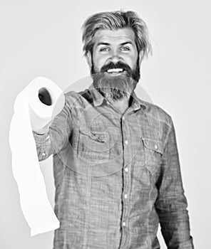 Guy having fun with toilet paper. Softness strength and absorbency. Prevent Toilet Paper Hoarding. Man hold toilet paper