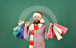 Guy or hipster shopper in red hat with shopping bags