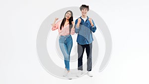 Guy and his girlfriend cheering shaking clenched fists, white background