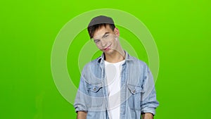 Guy jokes, he is not bored, he is happy and positive. Green screen
